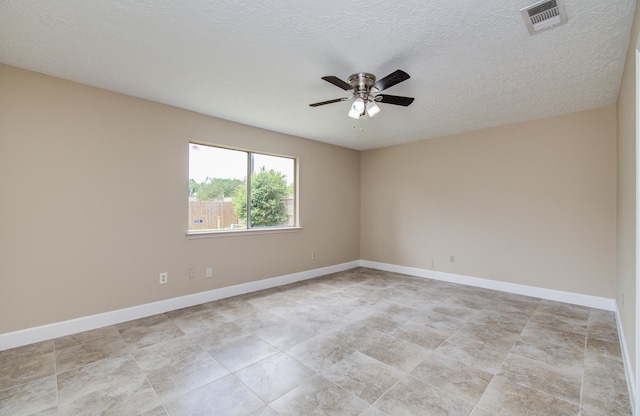 18011 Glenledi Dr, Houston, TX 77084 - empty room with ceiling fan, baseboards, and a textured ceiling