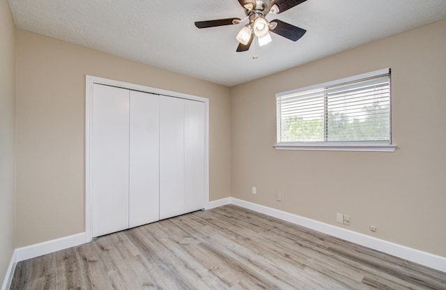 18011 Glenledi Dr, Houston, TX 77084 - unfurnished bedroom featuring wood finished floors, baseboards, a closet, and ceiling fan
