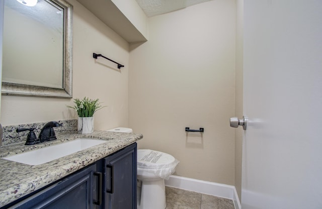 18011 Glenledi Dr, Houston, TX 77084 - bathroom featuring vanity, baseboards, toilet, and tile patterned floors