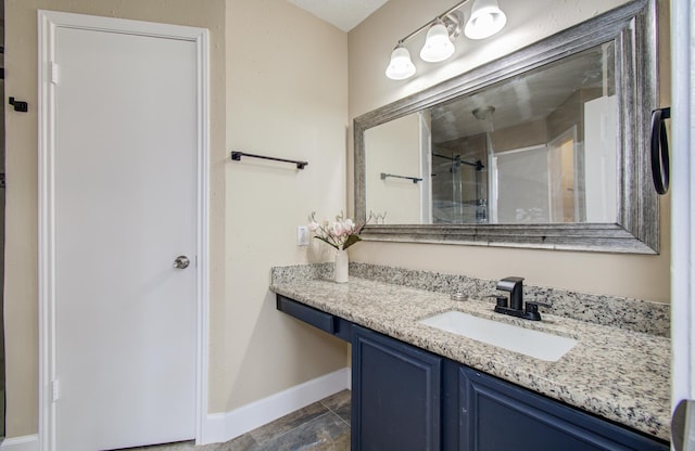 18011 Glenledi Dr, Houston, TX 77084 - bathroom with baseboards, vanity, and a shower with shower door