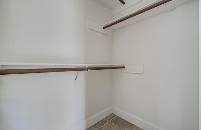 18011 Glenledi Dr, Houston, TX 77084 - walk in closet featuring tile patterned floors