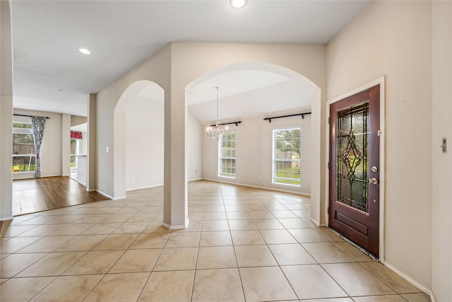 31827 Oak Thicket Ct, Conroe, TX 77385 - entrance foyer featuring light tile patterned flooring, recessed lighting, a chandelier, and arched walkways