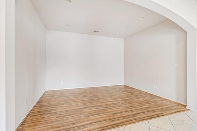 31827 Oak Thicket Ct, Conroe, TX 77385 - additional living space with arched walkways and light wood-type flooring