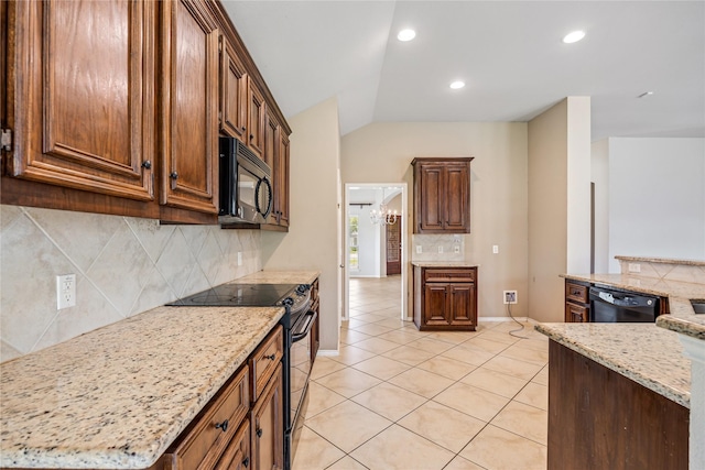 31827 Oak Thicket Ct, Conroe, TX 77385 - kitchen featuring black appliances, light tile patterned floors, tasteful backsplash, lofted ceiling, and light stone counters