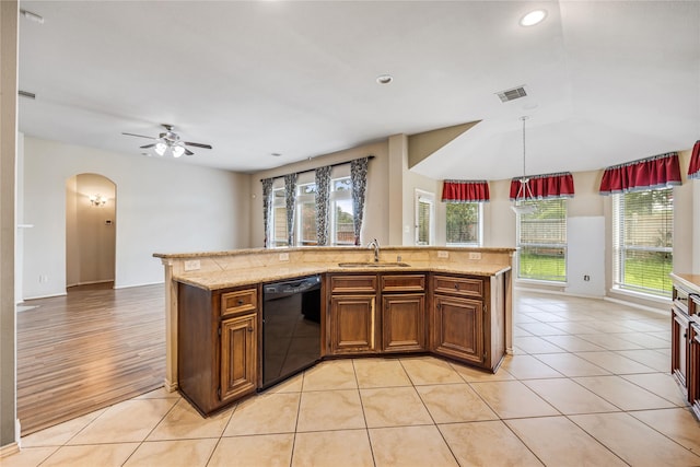 31827 Oak Thicket Ct, Conroe, TX 77385 - kitchen featuring black dishwasher, ceiling fan, arched walkways, pendant lighting, and recessed lighting