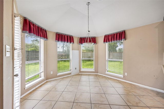 31827 Oak Thicket Ct, Conroe, TX 77385 - unfurnished dining area featuring light tile patterned flooring and vaulted ceiling