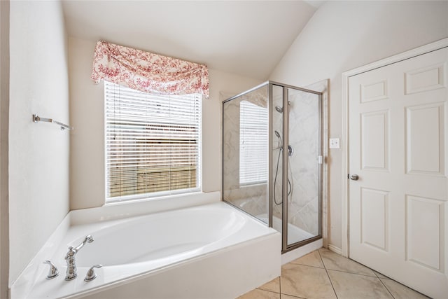 31827 Oak Thicket Ct, Conroe, TX 77385 - bathroom with a bath, healthy amount of natural light, a stall shower, tile patterned floors, and lofted ceiling