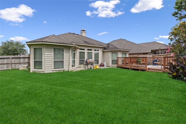 31827 Oak Thicket Ct, Conroe, TX 77385 - back of house featuring a deck and a chimney