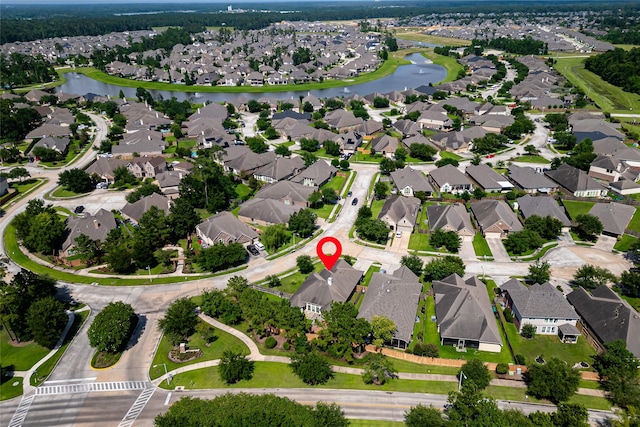 31827 Oak Thicket Ct, Conroe, TX 77385 - aerial view of property's location with nearby suburban area and a large body of water