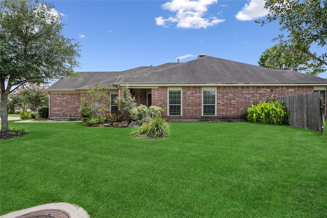 31827 Oak Thicket Ct, Conroe, TX 77385 - back of property with brick siding and roof with shingles
