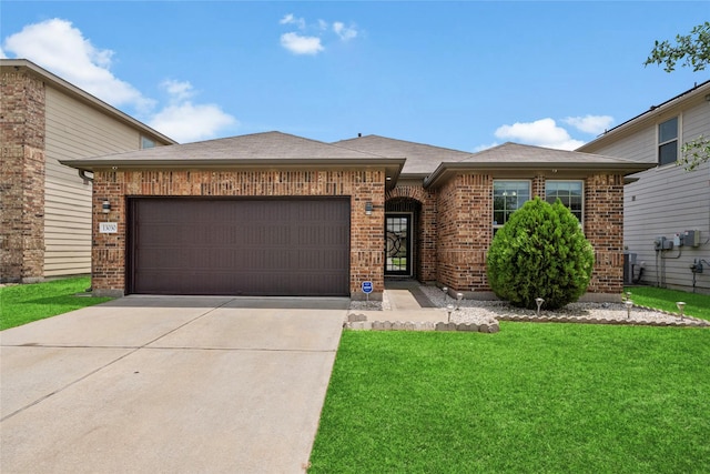 13030 Larriston Ln, Houston, TX 77044 - view of front of house featuring brick siding, driveway, an attached garage, a front lawn, and roof with shingles