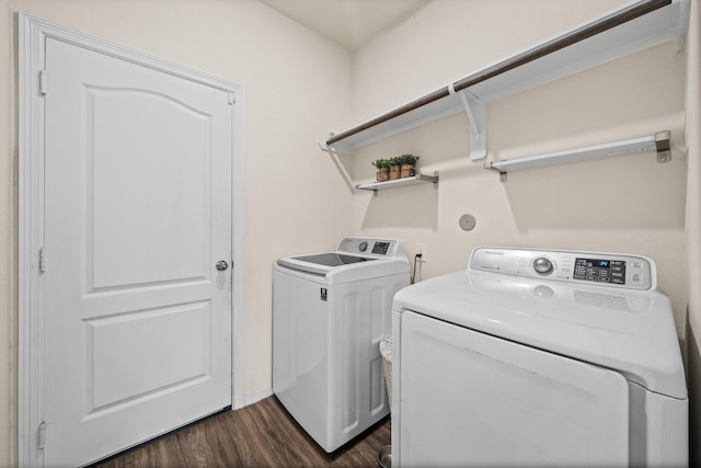 13030 Larriston Ln, Houston, TX 77044 - washroom with separate washer and dryer, dark wood-style flooring, and baseboards