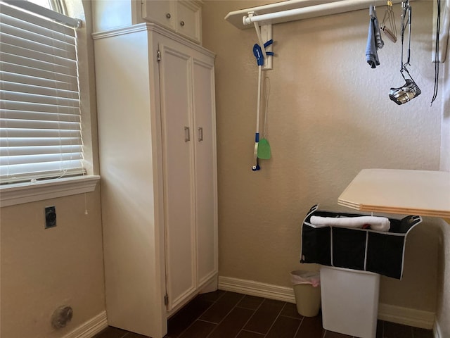 216 Dewberry Dr, Lake Jackson, TX 77566 - washroom with baseboards, cabinet space, and hookup for an electric dryer