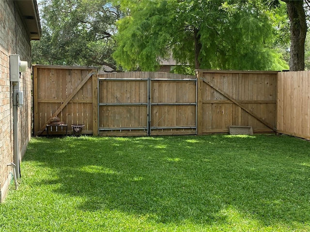 216 Dewberry Dr, Lake Jackson, TX 77566 - view of yard with a gate