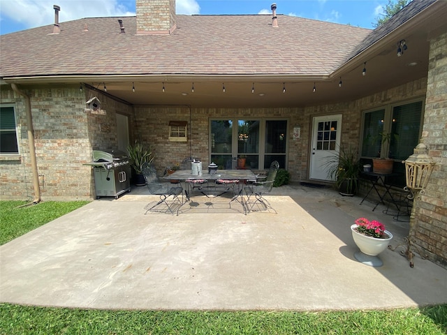 216 Dewberry Dr, Lake Jackson, TX 77566 - view of patio featuring grilling area and outdoor dining area