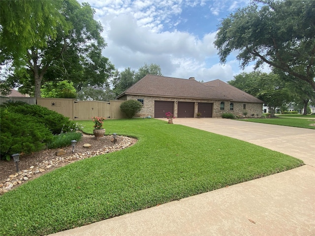 216 Dewberry Dr, Lake Jackson, TX 77566 - view of front facade featuring an attached garage, a gate, and concrete driveway