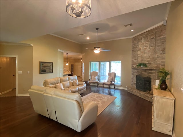216 Dewberry Dr, Lake Jackson, TX 77566 - living area with crown molding, dark wood-type flooring, a chandelier, baseboards, and a brick fireplace