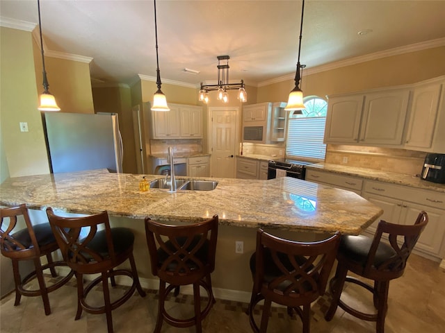 216 Dewberry Dr, Lake Jackson, TX 77566 - kitchen with freestanding refrigerator, a sink, decorative backsplash, white cabinets, and crown molding