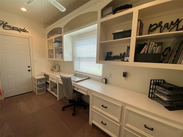 216 Dewberry Dr, Lake Jackson, TX 77566 - office area featuring built in desk, dark colored carpet, and ceiling fan