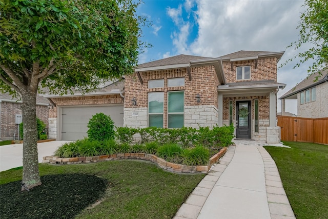 10615 Winding Arbor Ct, Cypress, TX 77433 - view of front of home featuring stone siding, brick siding, an attached garage, concrete driveway, and roof with shingles