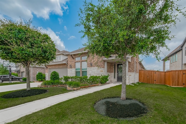 10615 Winding Arbor Ct, Cypress, TX 77433 - view of front facade with brick siding, stone siding, concrete driveway, and an attached garage