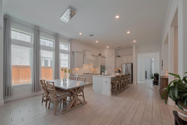 10615 Winding Arbor Ct, Cypress, TX 77433 - dining room with plenty of natural light, light wood-style floors, recessed lighting, and baseboards