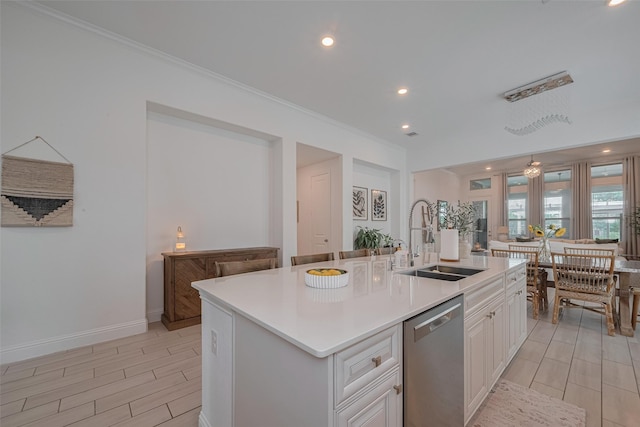 10615 Winding Arbor Ct, Cypress, TX 77433 - kitchen featuring dishwasher, a sink, crown molding, light countertops, and wood tiled floors