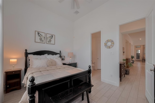 10615 Winding Arbor Ct, Cypress, TX 77433 - bedroom featuring ensuite bath, baseboards, and a ceiling fan