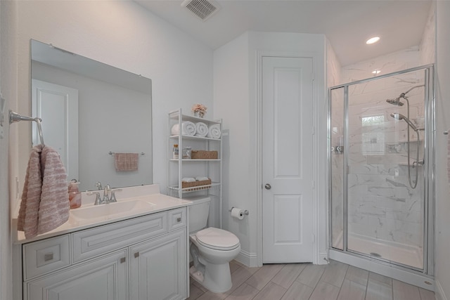 10615 Winding Arbor Ct, Cypress, TX 77433 - bathroom featuring a shower stall, vanity, toilet, and recessed lighting