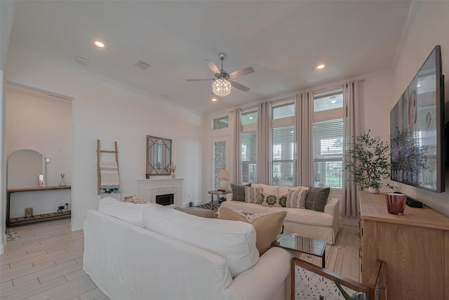 10615 Winding Arbor Ct, Cypress, TX 77433 - living room featuring crown molding, ceiling fan, a fireplace, and recessed lighting