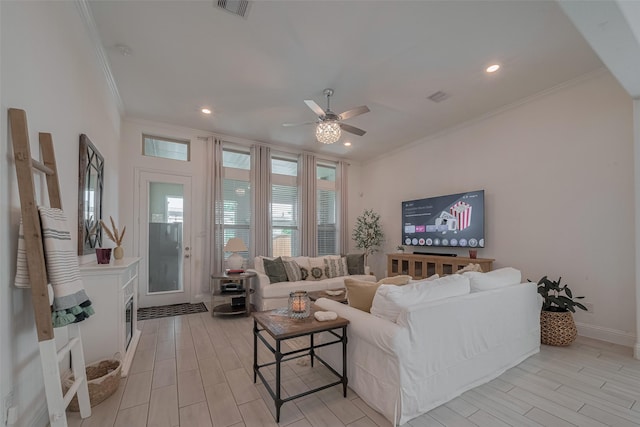 10615 Winding Arbor Ct, Cypress, TX 77433 - living room featuring crown molding, a ceiling fan, wood tiled floors, recessed lighting, and baseboards