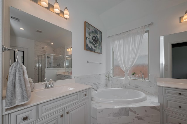 10615 Winding Arbor Ct, Cypress, TX 77433 - bathroom featuring vanity, lofted ceiling, a shower stall, and a garden tub