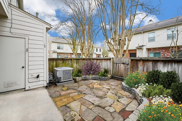 2910 Grants Lake Blvd Unit 1205, Sugar Land, TX 77479 - fenced backyard featuring central air condition unit, a patio, and a residential view