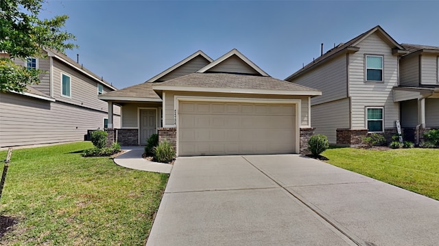 24734 Signorelli Way, Katy, TX 77493 - craftsman-style home featuring concrete driveway, an attached garage, a front lawn, brick siding, and a shingled roof