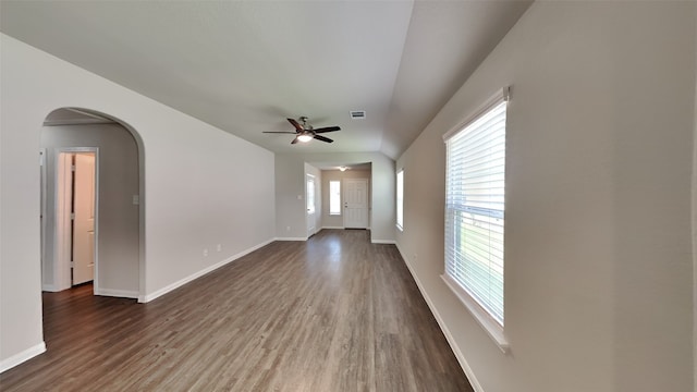 24734 Signorelli Way, Katy, TX 77493 - spare room featuring dark wood-type flooring, a ceiling fan, baseboards, and arched walkways