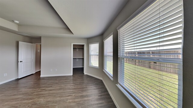 24734 Signorelli Way, Katy, TX 77493 - spare room featuring wood finished floors, baseboards, and a tray ceiling