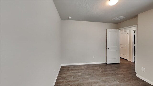 24734 Signorelli Way, Katy, TX 77493 - unfurnished bedroom with baseboards and wood finished floors