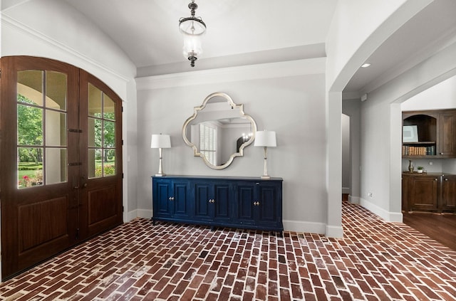 5342 Pine Wood Hills Ct, Spring, TX 77386 - entryway with brick flooring, french doors, arched walkways, baseboards, and vaulted ceiling