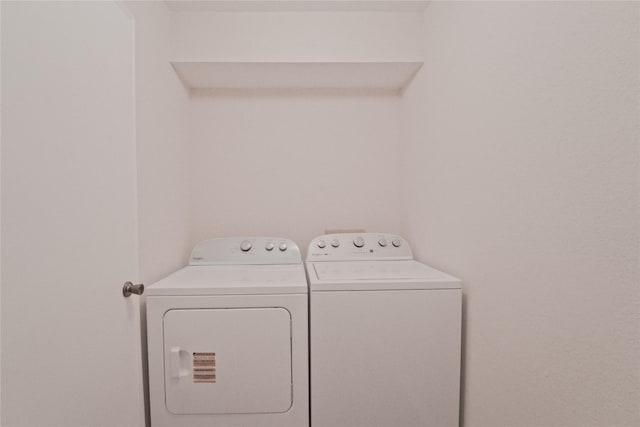 9700 Leawood Blvd Unit 406, Houston, TX 77099 - laundry area featuring washer and dryer