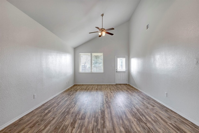 2331 Strong Horse Dr, Conroe, TX 77301 - unfurnished room with ceiling fan, wood finished floors, baseboards, high vaulted ceiling, and a textured wall