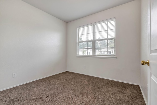 2331 Strong Horse Dr, Conroe, TX 77301 - empty room featuring carpet flooring and baseboards