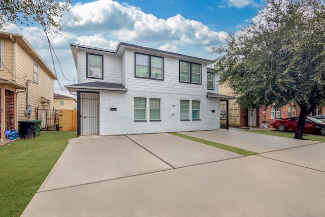 6933 Liverpool St, Houston, TX 77021 - view of front of house with brick siding, a gate, and a patio
