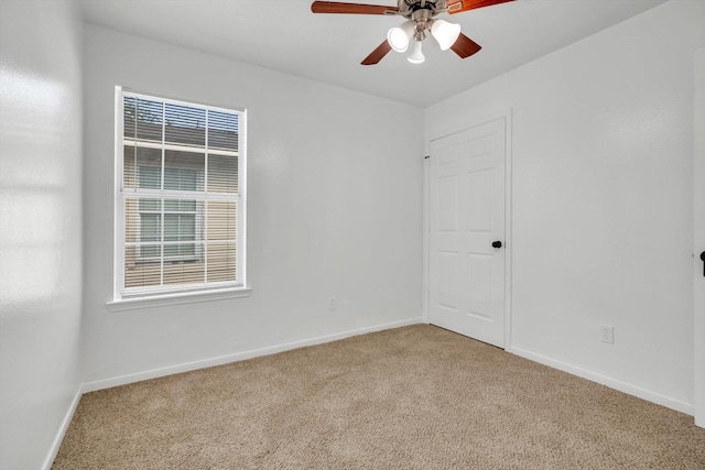 6933 Liverpool St, Houston, TX 77021 - unfurnished room featuring light colored carpet, a ceiling fan, baseboards, and plenty of natural light
