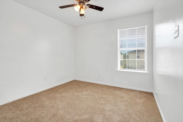 6933 Liverpool St, Houston, TX 77021 - unfurnished room with light carpet, ceiling fan, and baseboards