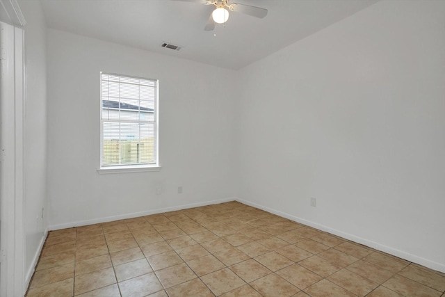 6933 Liverpool St, Houston, TX 77021 - empty room with a ceiling fan, light tile patterned flooring, and baseboards