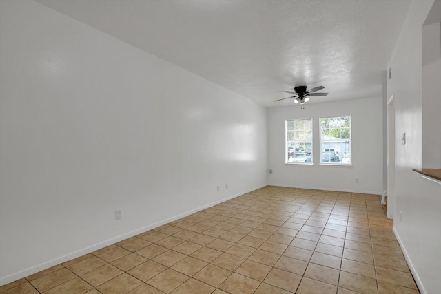 6933 Liverpool St, Houston, TX 77021 - spare room with a ceiling fan, light tile patterned floors, and baseboards