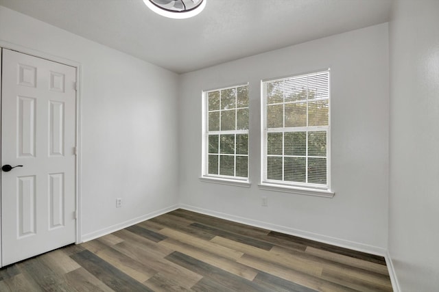 6933 Liverpool St, Houston, TX 77021 - unfurnished room with dark wood-style flooring and baseboards