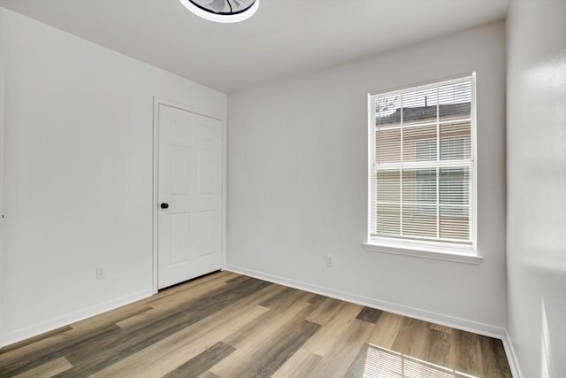 6933 Liverpool St, Houston, TX 77021 - spare room featuring wood finished floors and baseboards