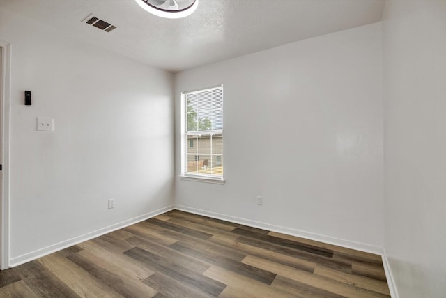 6933 Liverpool St, Houston, TX 77021 - unfurnished room featuring dark wood-type flooring and baseboards