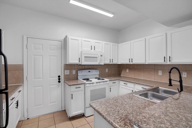6933 Liverpool St, Houston, TX 77021 - kitchen featuring white appliances, a sink, white cabinetry, backsplash, and light tile patterned floors